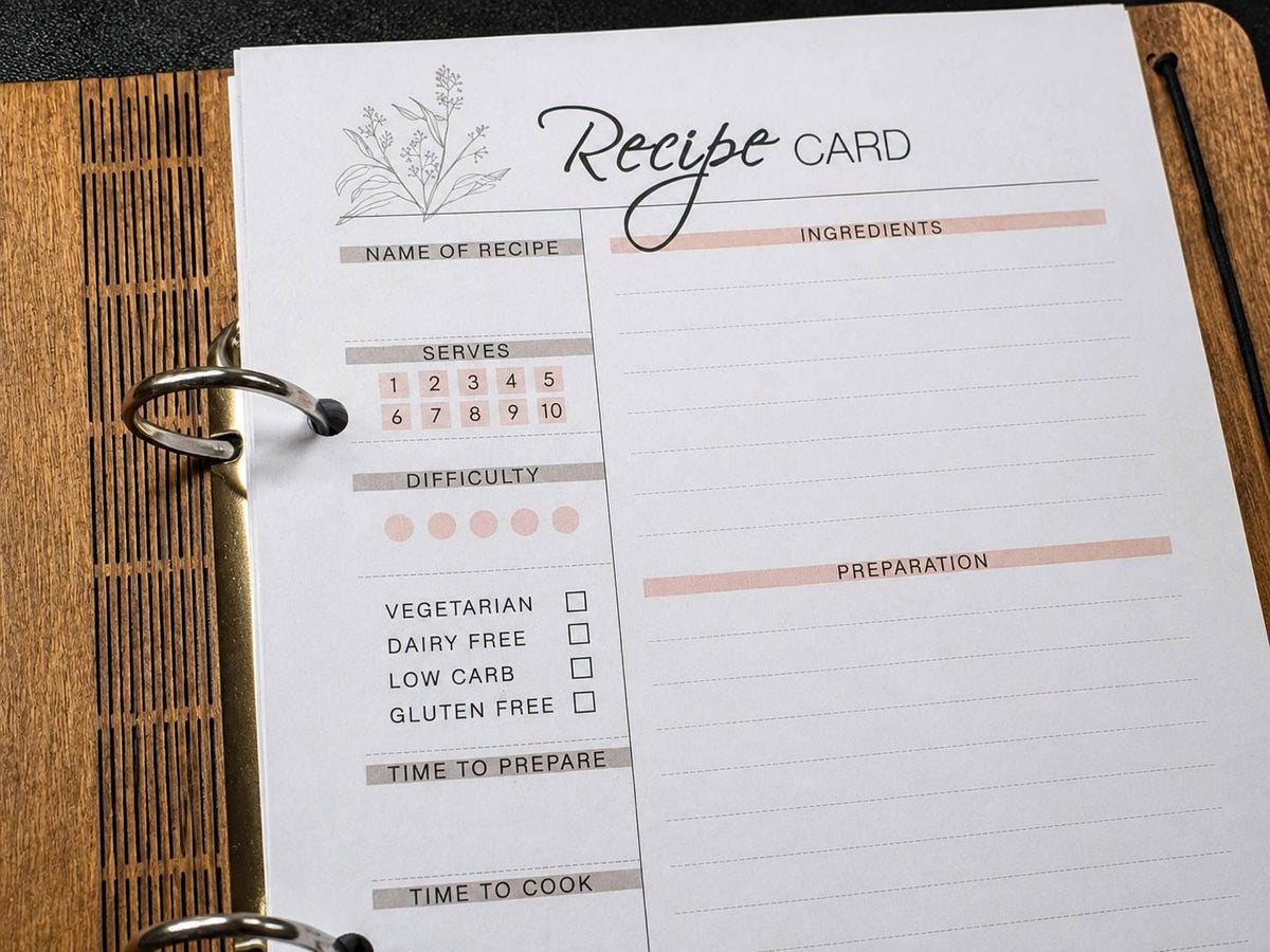 Close-up of a printed recipe card inside a ring-bound wooden recipe book