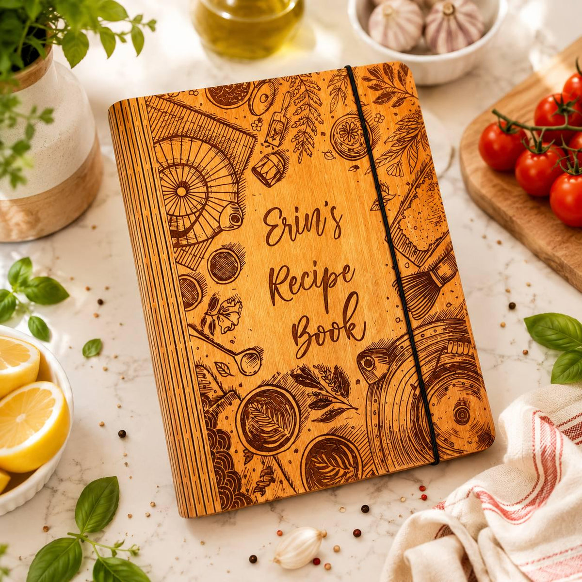 Erin's wooden recipe book with engraved kitchen motifs viewed from above