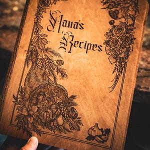 Caitlyn’s customer photo of a wooden Nana’s Recipes book with an engraved cover
